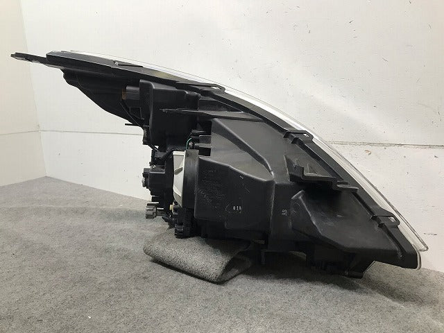 ティアナ J32/PJ32/TNJ32 純正 左ヘッドライト/ランプ レベライザーハロゲン 刻印A KOITO 100-63987 日産(114095)