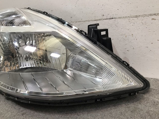 ティーダ C11/JC11/NC11 純正 後期 右ヘッドライト/ランプ ハロゲン レベライザー 刻印E STANLEY P7779 日産 (115482)