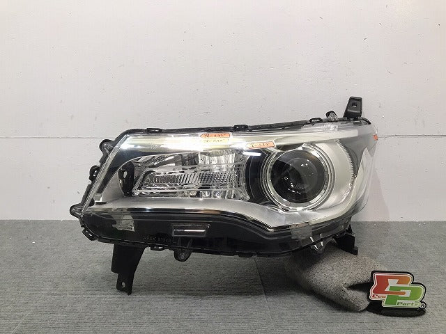 デイズ/ハイウェイスター/ekカスタム/B21W/B11W 純正 左ヘッドライト/ランプ ハロゲン レベライザー STANLEY W1048 日産 三菱 (118424)