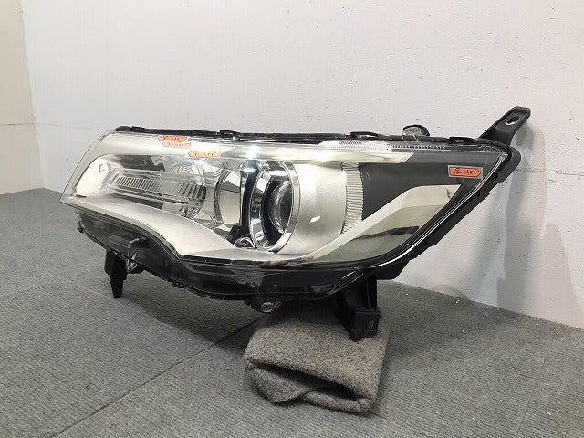 デイズ/ハイウェイスター/ekカスタム/B21W/B11W 純正 左ヘッドライト/ランプ ハロゲン レベライザー STANLEY W1048 日産 三菱 (118424)