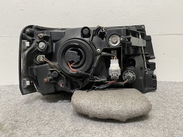 ミニキャブ/トラック/クリッパー/NT100 U61T/U62T/U71T/U72T 純正 左 ヘッドライト/ランプ ハロゲン STANLEY P570(145910)