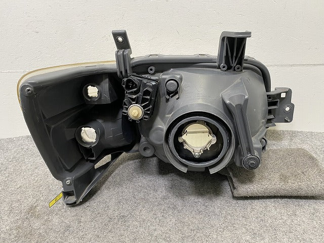 タウンエース/ライトエース S402M/S412M 純正 左 ヘッドライト/ランプ ハロゲン レベライザー 刻印A ICHIKOH 1819 トヨタ(148000)