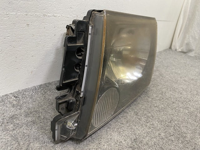 ミニキャブ U61V/U62V/U62T/U61W/U62W/U71 純正 左 ヘッドライト/ランプ ハロゲン 刻印0 STANLEY P1711 三菱(148607)