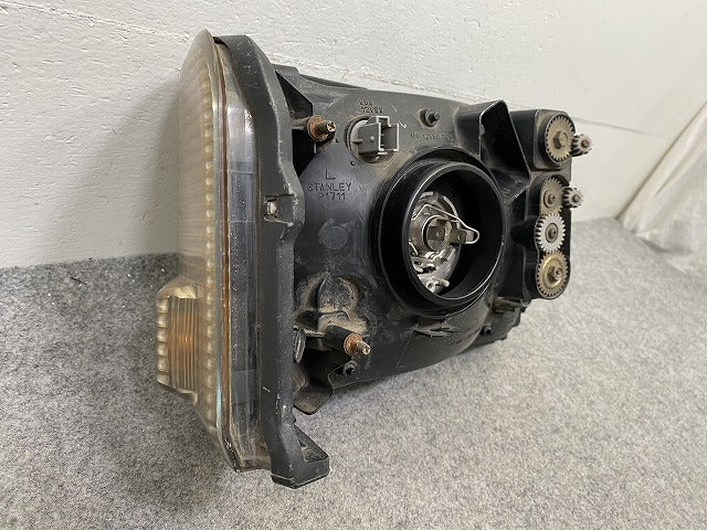 ミニキャブ U61V/U62V/U62T/U61W/U62W/U71 純正 左 ヘッドライト/ランプ ハロゲン 刻印0 STANLEY P1711 三菱(148607)