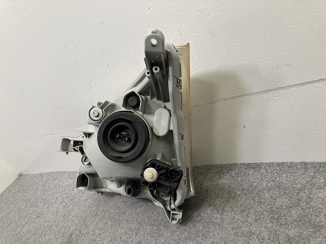 ムーヴ LA100S/LA110S 純正 前期 右 ヘッドライト/ランプ ハロゲン レベライザー 刻印ラ RH STANLEY P9501 ダイハツ(150639)